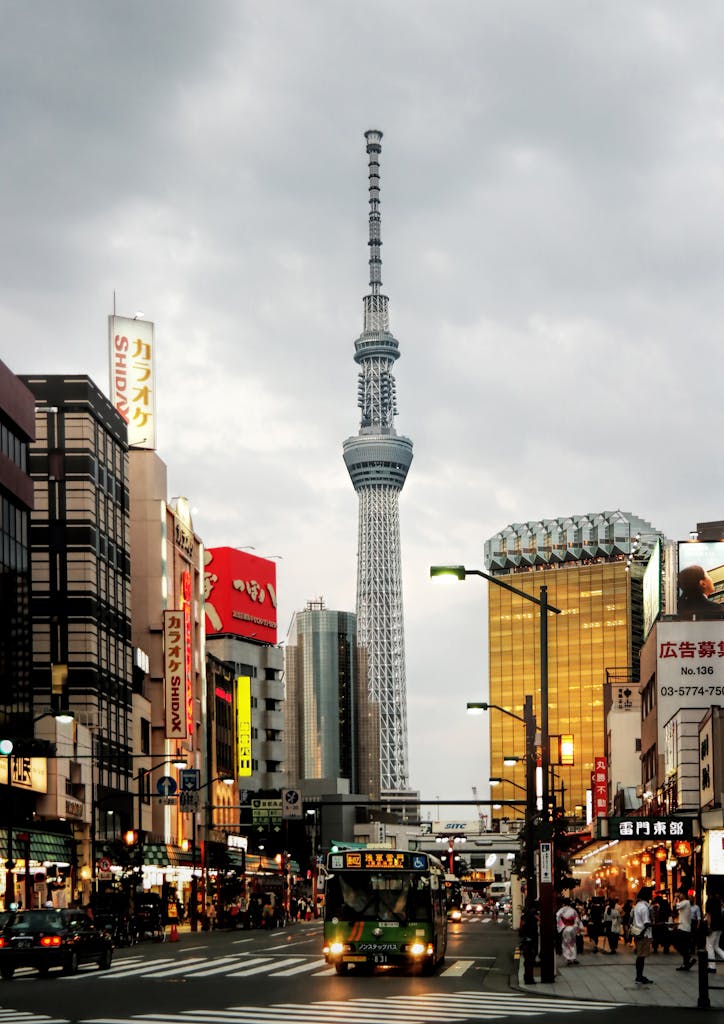Vibrant Tokyo city street view with the iconic Skytree tower in the background.